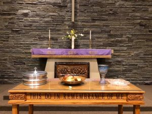 communion table with bread and chalis